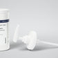 Kannaco Pro Cream Warming Formula 16 oz backbar jar with lid on, next to the pump assembly